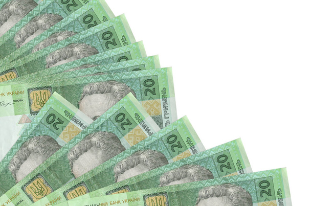 20 украинских гривен банкнот лежат на белом фоне с копировальным пространством, сложенным в вентилятор крупным планом. Концепция расчетного дня или финансовые операции - Фото, изображение