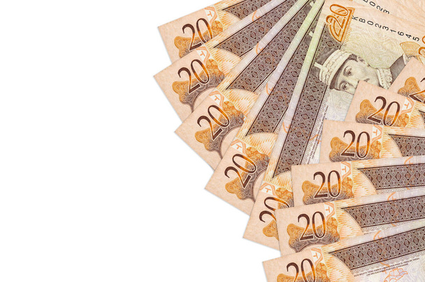 20 dominikanische Peso-Scheine liegen isoliert auf weißem Hintergrund mit Kopierraum. Reicher Lebenshintergrund. Großer Reichtum in Landeswährung - Foto, Bild