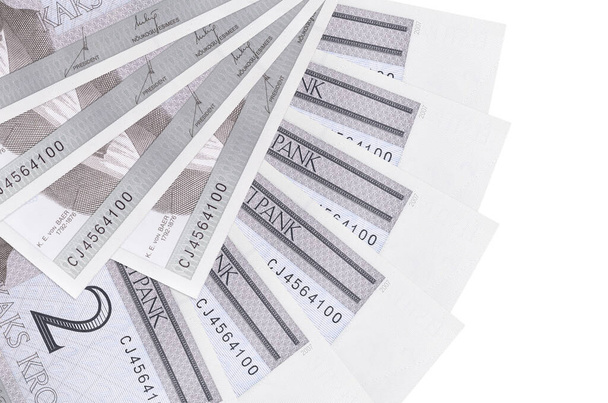 2 Estonian kroon bills lies isolated on white background with copy space stacked in fan shape close up. Financial transactions concept - Photo, Image