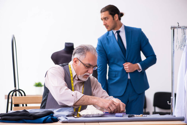 Young businessman visiting old male tailor - Photo, Image