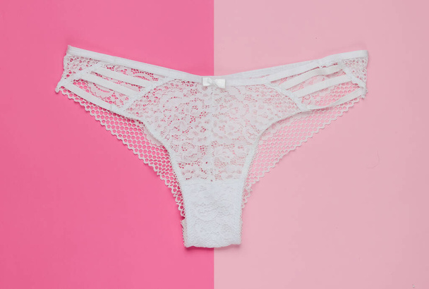 Women's sexy lace panties on a pastel pink background. Top view - Photo, Image