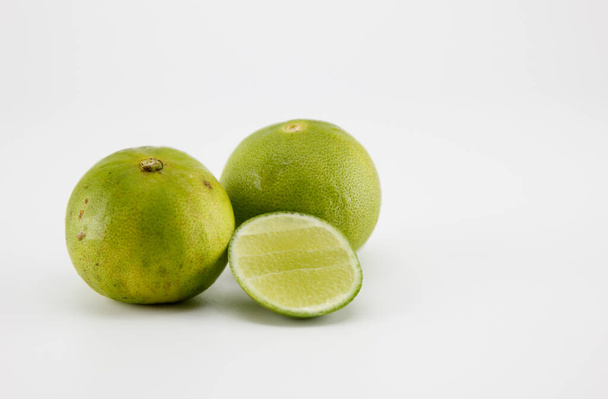 Half cut lime on a white background. - Foto, Imagen