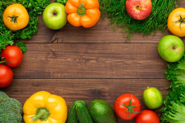 Healthy eating ingredients: fresh vegetables, fruits and superfood. Nutrition, diet, vegan food concept. Wooden background - Foto, Bild