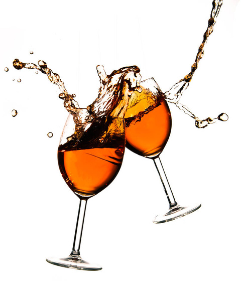Broken wine glasses with wine splashes on a white background - Photo, image