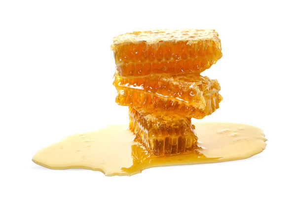Honeycomb piece. Honey slice isolated on white background. - Foto, imagen
