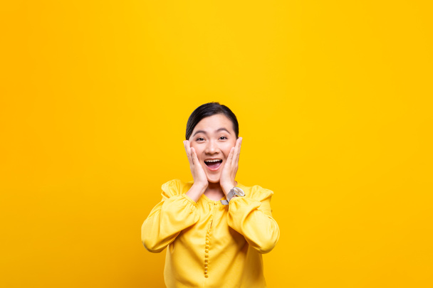 Portrait of excited woman isolated over background - Photo, Image