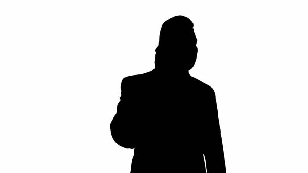Silhouette Businessman talking on mobile phone happily. - Foto, Imagen