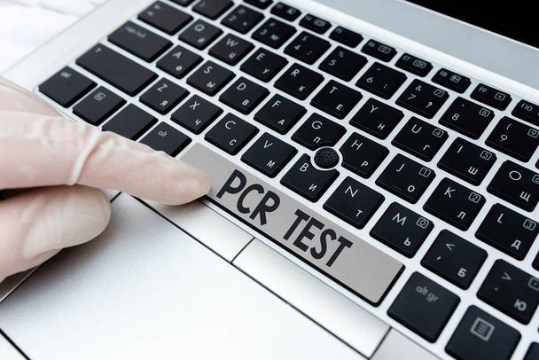 Writing note showing Pcr Test. Business photo showcasing qualitative detection of viral genome within the short seqeunce of DNA Different Colored PC keyboard key With Accessories on Empty background. - Photo, Image
