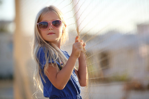pretty preteen blonde girl outdoors in summer - Фото, изображение