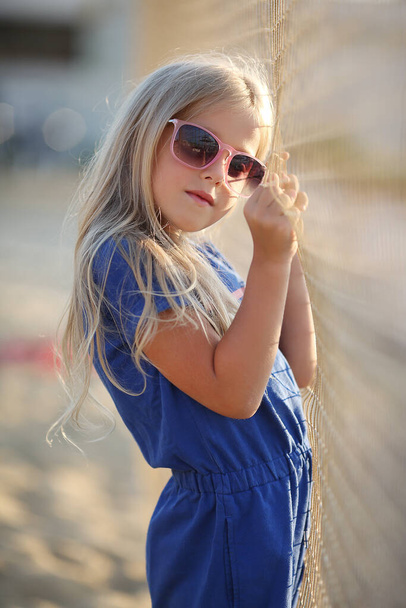 pretty preteen blonde girl outdoors in summer - Photo, image
