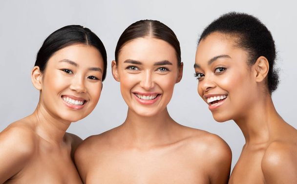 Three Diverse Models Women Smiling Posing Shirtless On Gray Background - Photo, Image