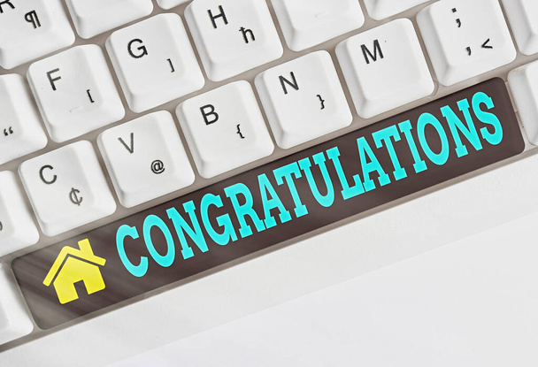 Text sign showing Congratulations. Conceptual photo a congratulatory expression usually used in plural form Different colored keyboard key with accessories arranged on empty copy space. - Photo, Image