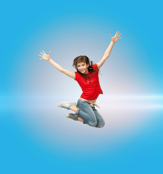 Smiling girl jumping - Valokuva, kuva