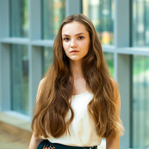 Portrait of a young beautiful brunette girl, indoor - Фото, зображення