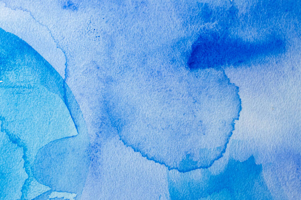 Abstract blue watercolor background with different layers on paper texture - Foto, imagen