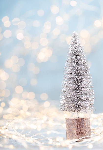 Christmas tree on bokeh background. Christmas holiday celebration concept. Greeting card.  - Photo, Image