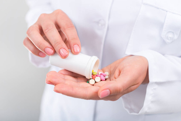 Photo of doctor prescribes pills and antibiotics. Medicine and treatment concept background. - Zdjęcie, obraz