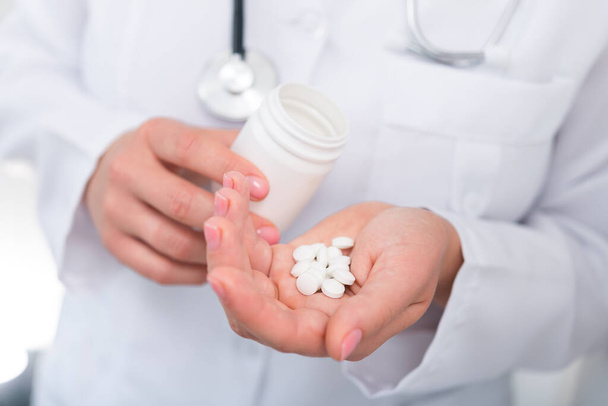 Photo of doctor prescribes pills and antibiotics. Medicine and treatment concept background. - Fotoğraf, Görsel