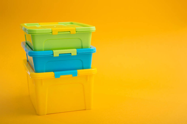 Plastic container box on a yellow background. School lunch box. - Photo, Image
