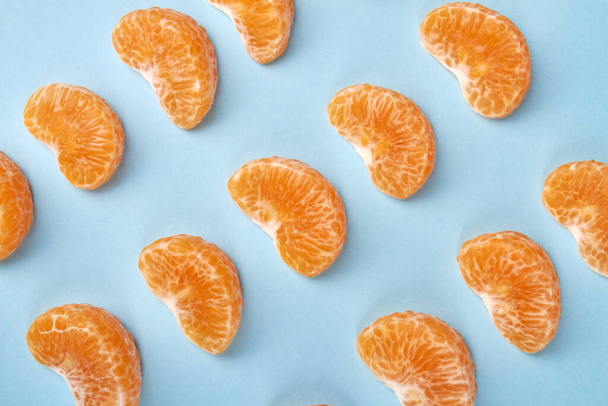 Rows of mandarin slices. - Фото, изображение
