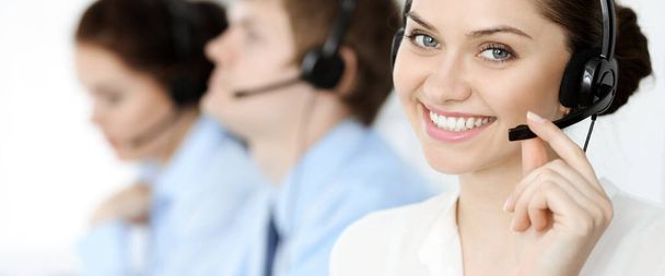 Call center. Diverse customer service operators in headsets at work in office. Business concept - Foto, Imagen