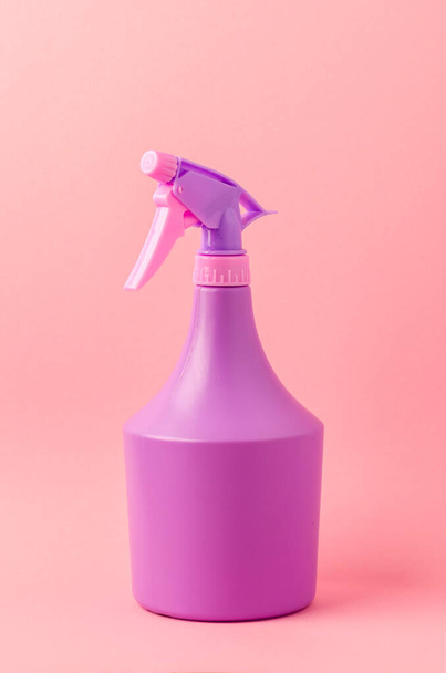 bottle with spray on pink background/purple spray bottle isolated on pink background - Photo, Image