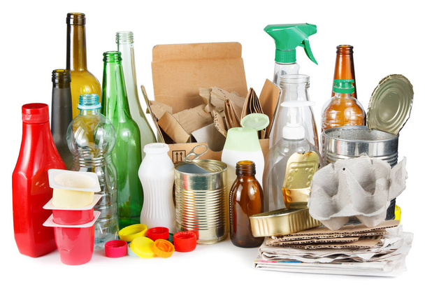 A selection of garbage for recycling. Segregated metal, plastic, paper and glass on white background  - Photo, Image