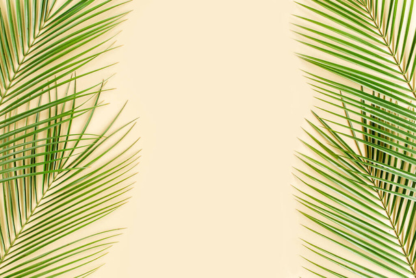 Tropical leaf on yellow background. Flat lay, top view - Fotoğraf, Görsel