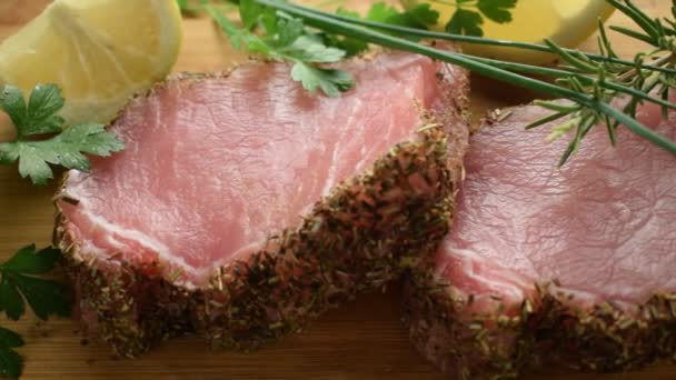 Close up on pork loin with herbs - Footage, Video