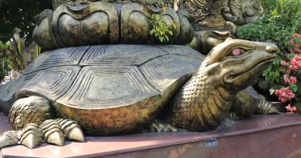 A statue turtle at Suoi Tien park in Ho Chi Minh Vietnam handheld - Footage, Video