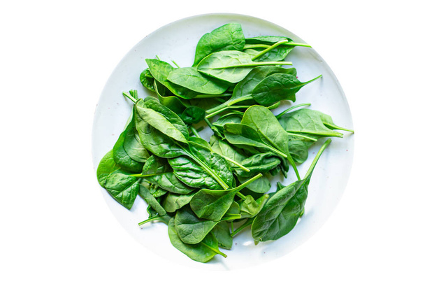 insalata di spinaci foglie succose verdi insalata biologica porzione dimensioni naturale vista dall'alto copia spazio per il testo dieta cibo crudo sfondo rustico - Foto, immagini