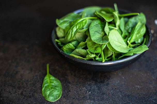 spinach salad green juicy leaves organic salad serving size natural top view copy space  for text diet raw food background rustic - Photo, Image