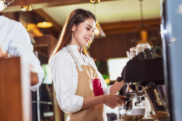 Asian Barista preparing cup of coffee, espresso with latte or cappuccino for customer order in coffee shop,making espresso, Small business owner and startup in coffee shop and restaurant concep - Φωτογραφία, εικόνα