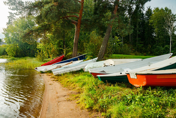 Rowing boats on coast of river at autumn - Photo, Image