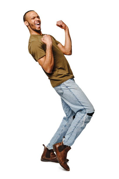 Young African-American man yes win gesturing over white background - Foto, afbeelding