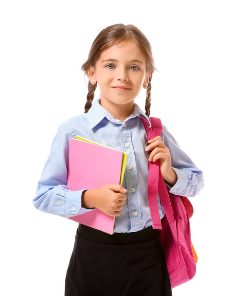 Μικρή μαθήτρια σε λευκό φόντο - Φωτογραφία, εικόνα