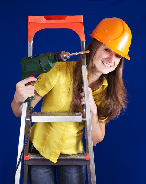 Female construction worker with drill - Valokuva, kuva