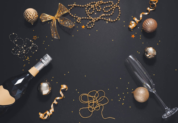Christmas composition with bottle of champagne on dark background - Photo, Image