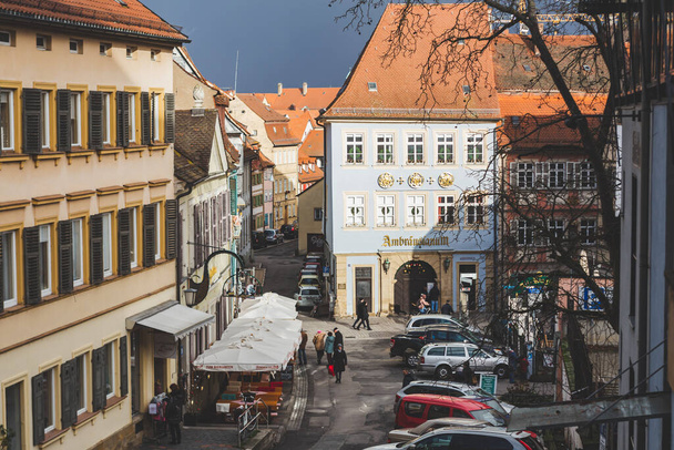 Bamberg/Germany-2/1/19: people walking on Dominikanerstrasse in the Old Town of Bamberg. Bamberg is a town in Upper Franconia, on the river Regnitz close to its confluence with the river Main - Valokuva, kuva
