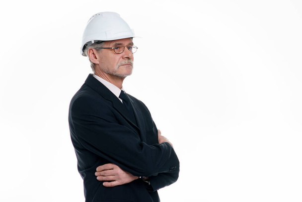 Portrait of business man, civil engineer and architect wear a white safety helmet crossed hands with copy space in white background. - Foto, afbeelding