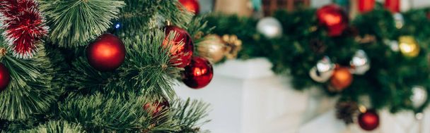 Panoramic shot of pine branches with christmas balls - Fotoğraf, Görsel