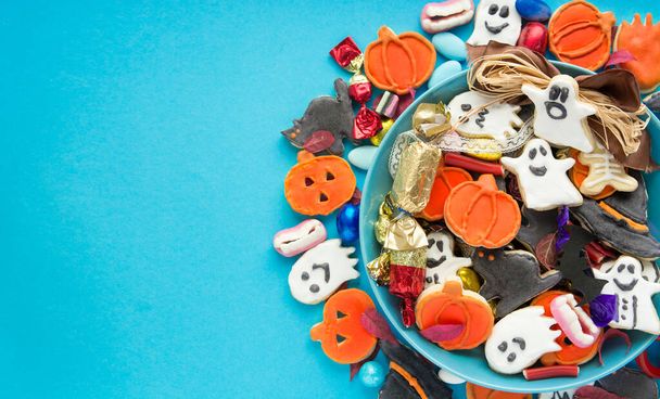 Halloween Jack o Lantern candy bowl with candy and halloween cookies Trick or Treat  card - Photo, image