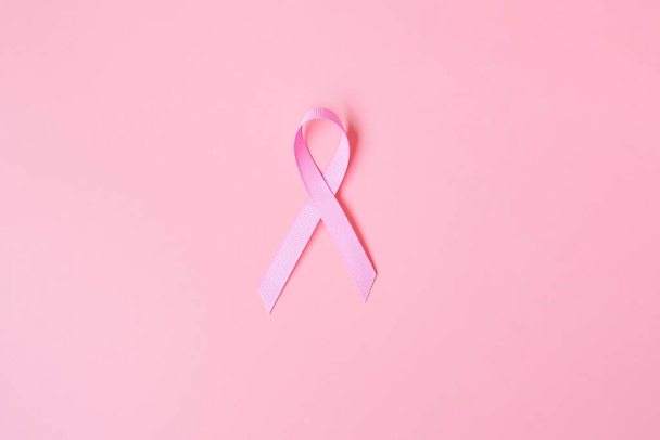 October Breast Cancer Awareness month, Pink Ribbon on pink background for supporting people living and illness. International Women, Mother and World cancer day concept - Фото, зображення