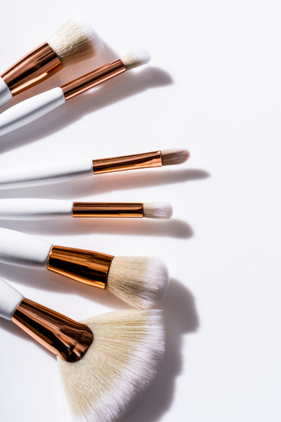 top view of cosmetic brushes set on white background - 写真・画像