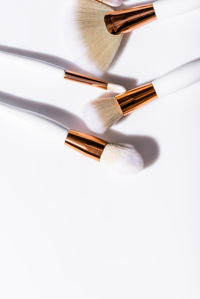 top view of cosmetic brushes set on white background - Fotó, kép