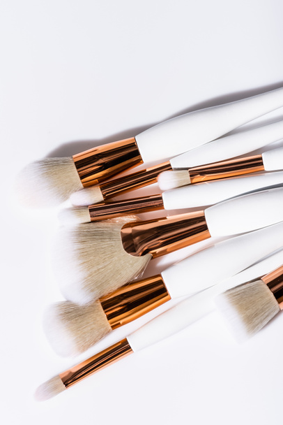 top view of cosmetic brushes set on white background - Foto, afbeelding