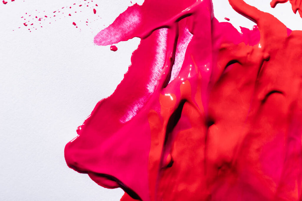 top view of pink lipstick brushstrokes on white background - Fotografie, Obrázek