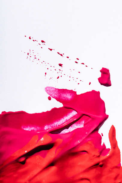 top view of pink lipstick brushstrokes on white background - 写真・画像