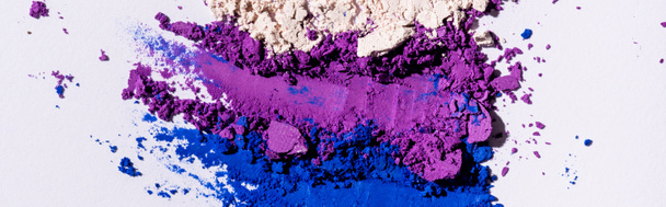 top view of purple, blue and white eyeshadow powder, panoramic shot - Foto, Bild