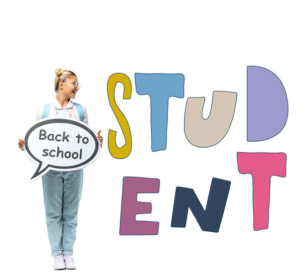 Schoolgirl holding speech bubble with back to school lettering near student illustration on white  - Photo, Image